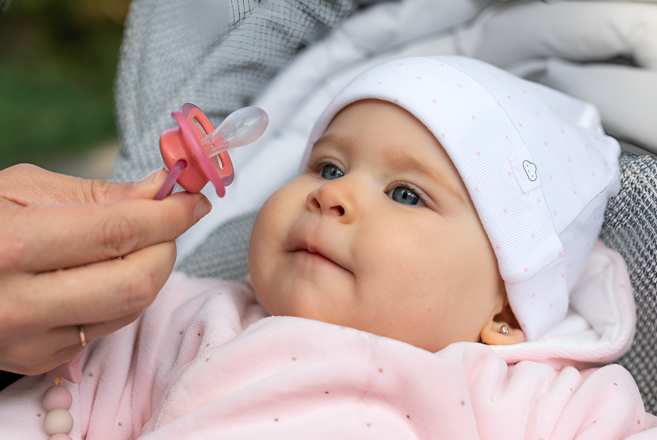 Attache tétine rose bébé