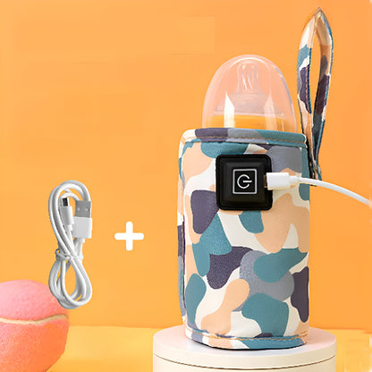 Un chauffe biberon portable avec un câble de charge sur une plate-forme blanche.