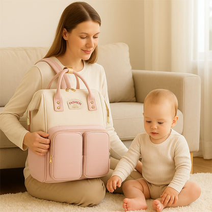 Sac a dos a langer FashionTravel  rose bébé maman salon